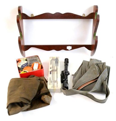 Lot 330 - Accessories, comprising a mahogany wall mounted gun rack, a Rhino 4x32 rifle scope, an air gun...