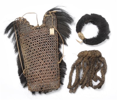 Lot 366 - An Abor, Assam Back Pack, of woven wicker trimmed with animal hair, possibly hog, 65cm high; A Naga