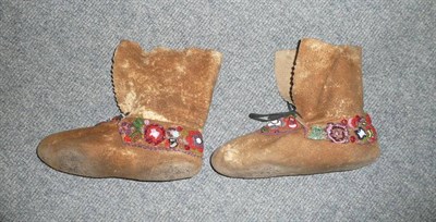 Lot 392 - A Pair of Woodlands Indian Hide Moccasins, decorated with flowerheads and leaves in coloured...