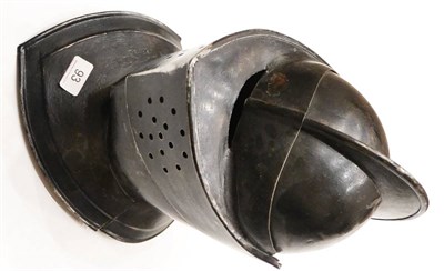 Lot 93 - A Copy of a Medieval Close Helmet, in black painted steel, the two piece skull with raised...