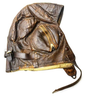 Lot 99 - A Second World War RAF Type B Leather Flying Helmet, with zipped ear pieces, the suede lining...