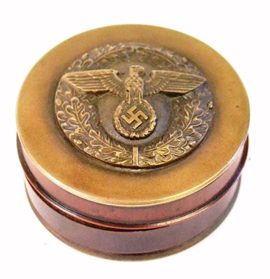 Lot 125 - A Copy of a German Third Reich Brass and Composition Snuff Box, of compressed cylindrical form, the