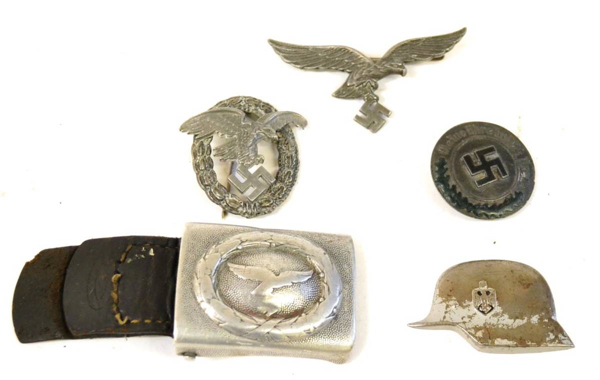 Lot 126 - A German Third Reich Luftwaffe Belt Buckle, in aluminium, the eagle and swastika partially...