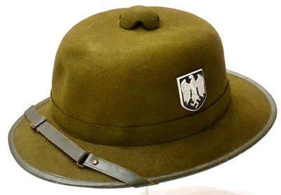 Lot 137 - A German Third Reich Tropical Pith Helmet, of one piece moulded stiffened dark olive green...