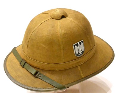 Lot 138 - A German Third Reich 1940 Pattern Tropical Pith Helmet, of cork covered in light tan canvas,...