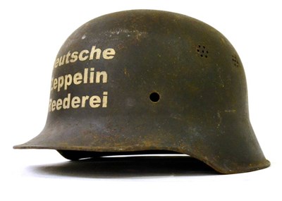 Lot 150 - A German Third Reich M35 Civil Defence Helmet Shell, to the Police, with double decal; another...