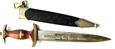 Lot 156 - A German Third Reich NSKK Dagger, the double edge steel blade etched Alles fur Deutschland and with