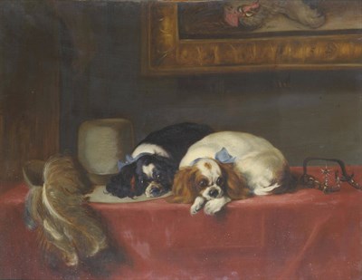 Lot 420 - After Sir Edwin Landseer Two King Charles Spaniels recumbent by a cavalier's hat and spurs on a red