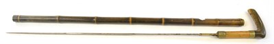 Lot 211 - A 19th Century Bamboo Swordstick, with 67cm single edge fullered steel blade, with two nickel...