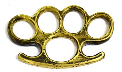 Lot 259 - A Brass Knuckleduster, the palm grip stamped with a broad arrow