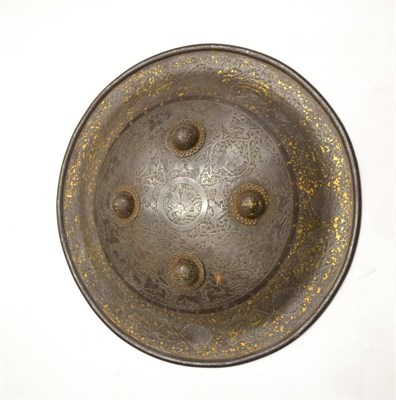 Lot 281 - A 19th Century Qajar Steel Dhal Shield, of convex circular form, chased and engraved with...