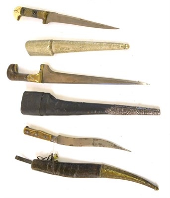 Lot 296 - Two 19th Century Indian Pesh Kabz, each with T section steel blade, one with pique decorated...