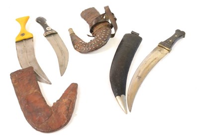 Lot 299 - An Arab Jambiya, the curved steel blade with raised medial ridge, horn grip and leather...