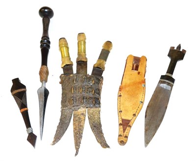 Lot 300 - A Set of Three Sudanese Daggers, each with Thuluth script inlaid steel blade, brass wire bound horn