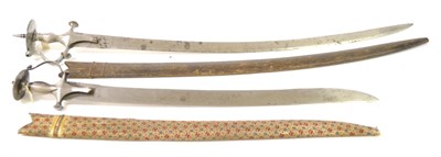 Lot 303 - A 19th Century Indian Talwar, the 82.5cm curved steel blade double edged for the last 22cm, the...