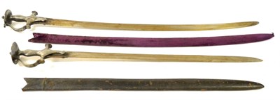 Lot 304 - A 19th Century Indian Talwar, the 89cm single edge steel blade with two narrow fullers to the...