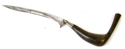 Lot 307 - A 19th Century Malayan Bade Bade, the 20cm single edge curved steel blade with raised medial...