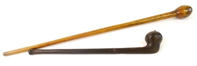 Lot 316 - A Zulu Ebony Knobkerry, the off-set globular head with small pointed nipple, on a tapering...