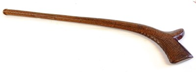 Lot 329 - A Fijian Gunstock War Club, of dark red hardwood, all-over carved with panels of diapering and...