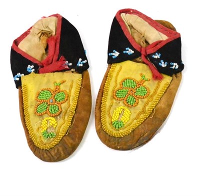 Lot 331 - A Pair of North American Indian Hide Moccasins, with beadwork decoration of flowerheads and...