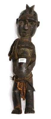 Lot 337 - A Late 19th/Early 20th Century African Wood Ancestor Figure,  with combed coiffure, chevron...