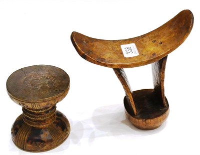 Lot 338 - A Boni, Somalia, East Africa Headrest, carved from one piece of wood, with dished oblong pillow...