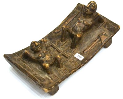 Lot 339 - An African Hardwood Altar Piece, possibly Cameroon, carved as two women in crab-like positions on a