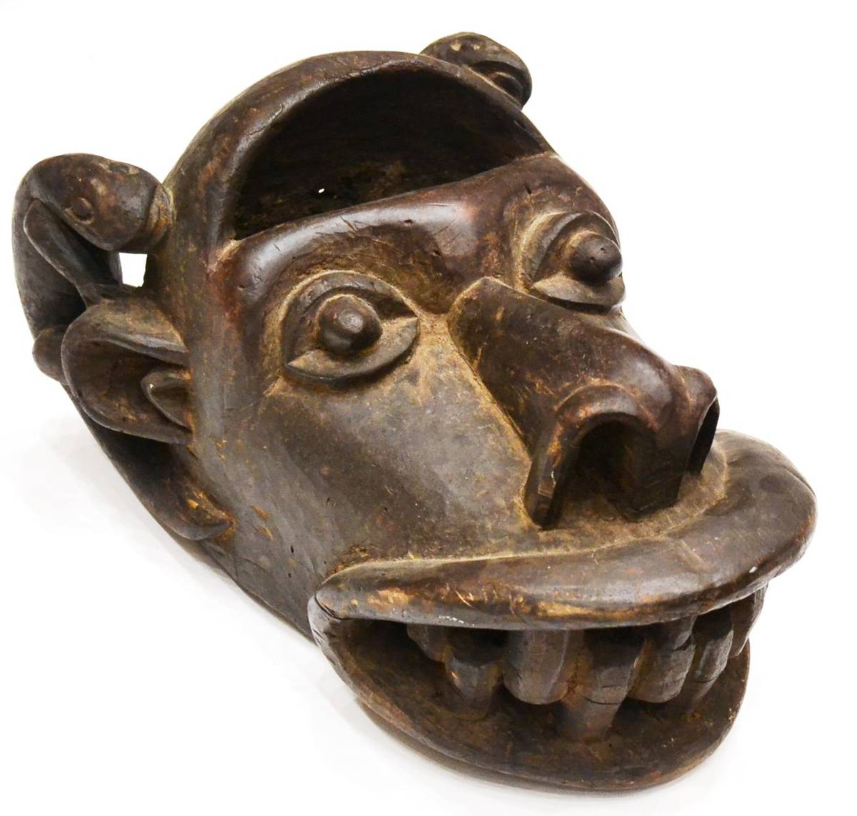 Lot 341 - A Bamileke, Cameroon Helmet Mask, with pierced domed forehead, protruding eyes, large nose with...