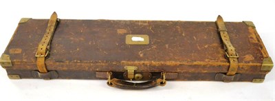 Lot 373 - A Brass Bound Stitched Leather Shotgun Case, the green baize lined interior fitted to take 28";...