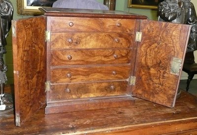 Lot 461 - A Burr Oak Table Cabinet, circa 1870, rectangular section, with two ogival arched fielded panel...