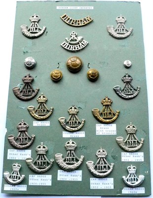 Lot 119 - The Durham Light Infantry, a Collection of Fourteen Cap and Collar Badges, two shoulder titles...