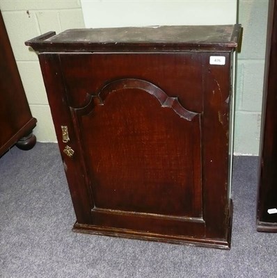 Lot 476 - A George II Oak Hanging Cupboard, mid 18th century, the bold cornice above a single fielded...