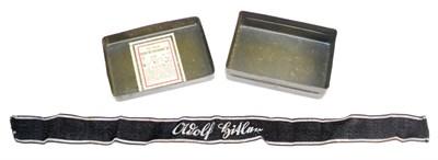 Lot 223 - German Third Reich, an SS Adolf Hitler Cuff Band and a Nebel-Brennzunder 38 Grenade Fuse Tin...