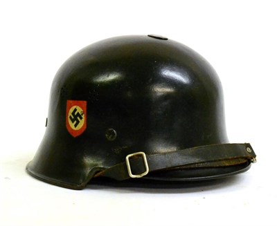 Lot 226 - A German Third Reich Steel Helmet, black-enamelled and with twin transfer Party decals,...