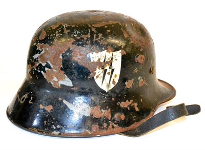 Lot 227 - A German Third Reich Waffen SS M35 Steel Helmet, black-enamelled and with twin swastika emblems...