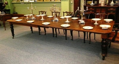 Lot 480 - A Victorian Oak Extending Dining Table, late 19th century, the rectangular top with canted corners