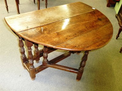 Lot 481 - An Oak Gateleg Table, 18th century and later, the rectangular top with two hinged drop leaves...