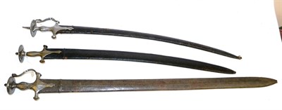 Lot 274 - A 19th Century Indian Talwar, the 89cm single edge steel blade with three narrow fullers and...