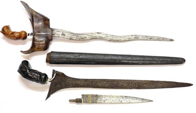 Lot 277 - A Malayan Kris, with 36cm five lok double edge fullered pamor steel blade, flame figured wood...