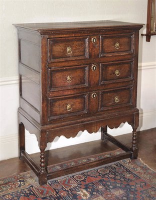 Lot 484 - An Early 18th Century Joined Oak Chest on Stand, the rectangular top above three conforming moulded