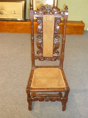 Lot 488 - A Late 17th Century Joined Oak Side Chair, with caned back and seat, the carved top rail with...