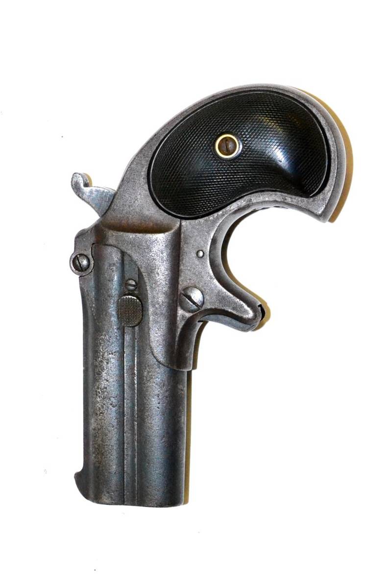 Lot 340 - A Remington over and under double barrel Derringer pistol, the barrels length 7.5 cm, hinged at the