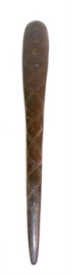 Lot 294A - A Wood Paddle Club, possibly Aboriginal, of flattened, elongated lozenge form, allover carved...