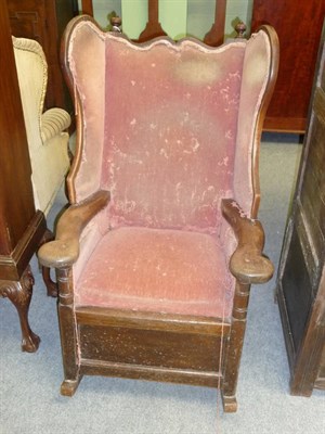 Lot 494 - A Joined Oak Wing Back Rocking Chair, 18th century and later, the wavy shaped top rail with...