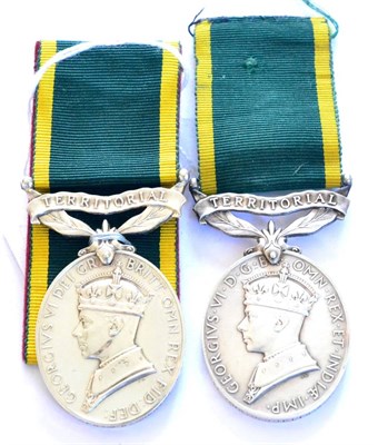 Lot 64 - Two Efficiency Medals, each with TERRITORIAL suspender bar, one awarded to 3448941. CFN....