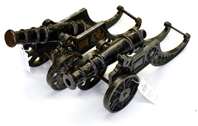 Lot 152 - A Pair of Black Painted Cast Iron Model Cannons, each on a carriage with spoked wheels, one...