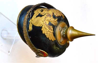 Lot 160 - A German Officer's Pickelhaube to a Baden Infantry  Regiment, with one piece leather skull, leather