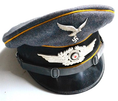 Lot 181 - A German Third Reich Luftwaffe EM/NCO's Visor Cap, in grey-blue wool with golden yellow/brown...