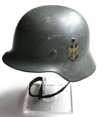 Lot 183 - A German Third Reich M35 Double Decal Army Helmet, in apple green with Heer eagle and tricolour...