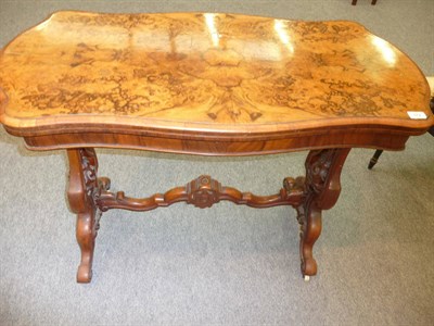 Lot 512 - A Victorian Walnut Serpentine Shaped Card Table, 3rd quarter 19th century, the hinged top enclosing